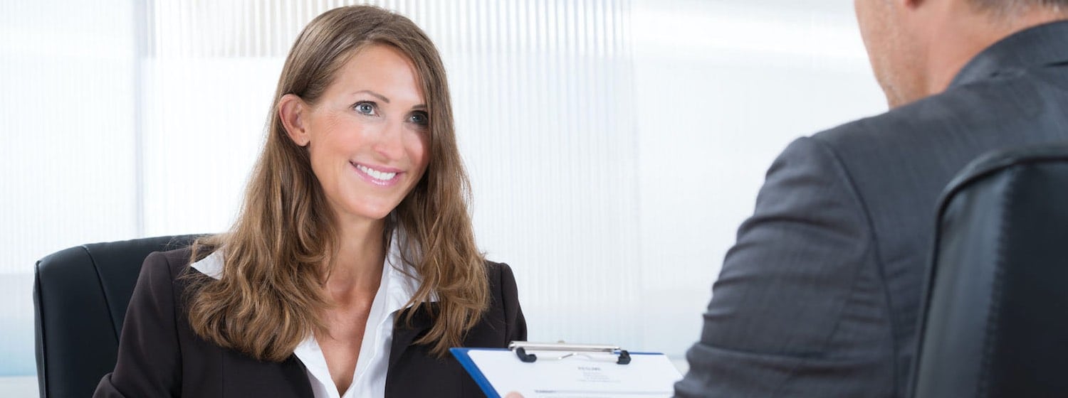 Professional Woman smiling, being interviewed